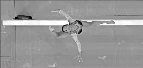  ?? Robert Deutsch-USA TODAY Sports ?? Sunisa Lee (USA) competes on the balance beam in the women’s gymnastics individual all-around final during the Tokyo 2020 Olympic Summer Games at Ariake Gymnastics Centre on Thursday in Tokyo.