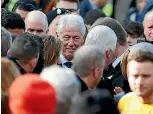  ??  ?? Former US President Bill Clinton, centre, joins mourners for the funeral of Martin McGuinness at St Columba’s Church in Londonderr­y.