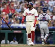  ?? MICHAEL PEREZ — THE ASSOCIATED PRESS ?? Phillies’ first baseman Carlos Santana tosses his bat after striking out during the sixth inning of Saturday’s game against the Mets.