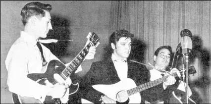  ?? ASSOCIATED PRESS FILE ?? Scotty Moore, left, who died last week, is shown performing with Elvis Presley and Bill Black, right, in 1957.