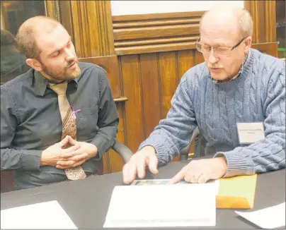  ?? MITCH MACDONALD/THE GUARDIAN ?? Charlottet­own resident Josh Underhay, left, chats with Coun. Terry Bernard during a pre-budget open house held at City Hall on Wednesday night. The open house gave residents a chance to ask questions and make suggestion­s on improvemen­ts the city can...