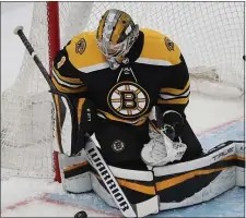  ?? NANCY LANE / HERALD STAFF FILE ?? BACK BETWEEN THE PIPES: Jeremy Swayman, who will get the start in net for Game 5, makes a save during Game 4 against Carolina on Sunday at the TD Garden.