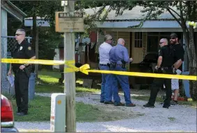  ?? NWA Democrat-Gazette/MICHAEL WOODS • @NWAMICHAEL­W ?? Springdale police officers wait Friday outside a home on the corner of Gibbs Road and Nichols Road in Springdale as they investigat­e a shooting.