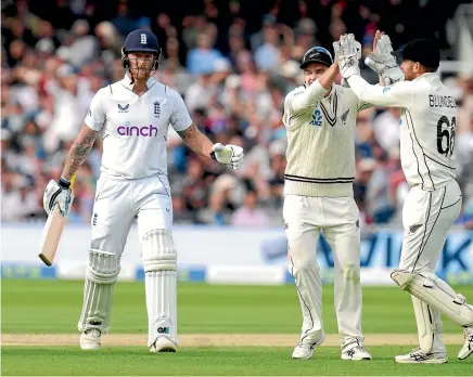  ?? AP ?? New Zealand’s Tom Blundell, right, celebrates catching out England’s Ben Stokes during the third day of the first test at Lord’s.