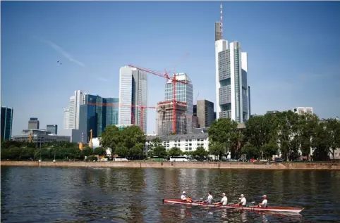  ?? (Kai Pfaffenbac­h/Reuters) ?? THE SKYLINE of Frankfurt’s banking district is pictured last July. Last year, with unions securing strong wage hikes, employment at record levels and interest rates on bank deposits delivering almost no return, private households in Europe’s largest...
