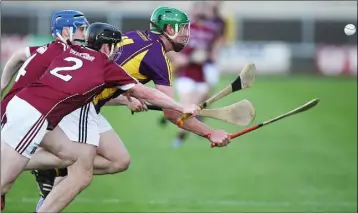  ??  ?? Danny Martin Carroll comes under pressure from Galway duo Vincent Doyle and Shane Bannon.