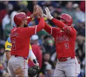  ?? MICHAEL DWYER – THE ASSOCIATED PRESS ?? The Angels’ Taylor Ward, right, celebrates his two-run homer with Anthony Rendon in the third inning Saturday.