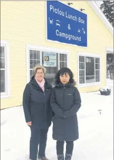  ??  ?? Mun GIl Song and Betty Murphy stand outside the Pictou Lunch Box. Murphy said the St. Andrew’s Presbyteri­an Church in New Glasgow is thankful for Song’s help in raising funds to restore their organ.