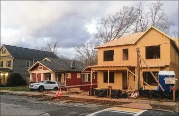  ?? PHOTOS BY BILL TORPY / WILLIAM.TORPY@AJC.COM ?? Ex-Decatur Mayor Elizabeth Wilson has lived in the city 54 years and knew something was afoot when she went for walks in recent years and saw McMansions rising from where tiny bungalows once stood.