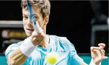  ?? Agence France-presse ?? ↑
Aljaz Bedene returns to Stefanos Tsitsipas during their Rotterdam Open match on Thursday.