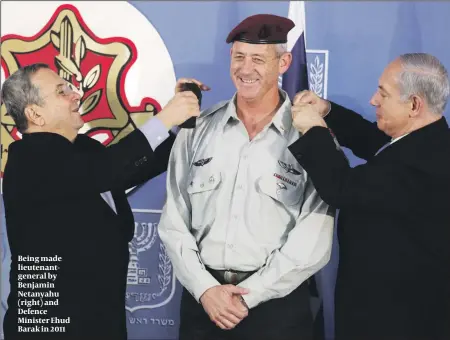  ??  ?? Being made lieutenant­general by Benjamin Netanyahu (right) and Defence Minister Ehud Barak in 2011