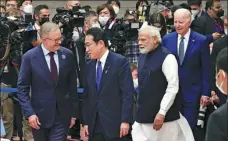  ?? KYODO NEWS VIA GETTY IMAGES ?? Australian Prime Minister Anthony Albanese (from left), Japanese Prime Minister Fumio Kishida, Indian Prime Minister Narendra Modi and US President Joe Biden prepare on Tuesday to attend a summit in Tokyo of the Quad group of Indo-Pacific nations.