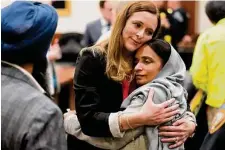  ?? Melissa Phillip/Staff photograph­er ?? Harris County prosecutor Katie Warren, left, and the deputy’s sister, Harpreet Rai, hug after closing statements Wednesday.