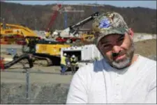  ?? GENE J. PUSKAR — THE ASSOCIATED PRESS ?? In this photo, Chip Kohser, the Beaver county Republican chairman, stands overlookin­g the constructi­on of a chemical plant on the banks of the Ohio River near Beaver, Pa., that will help convert natural gas into plastic, creating hundreds of jobs in an...