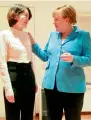  ?? AFP ?? German Chancellor Angela Merkel (right) speaking with Li Wenzu in Beijing. —