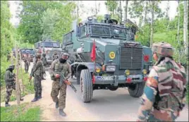  ?? PTI PHOTO ?? Army cordon off the area near the house where militants were hiding during an encounter at Bahmnoo in Pulwama district of south Kashmir on Monday.