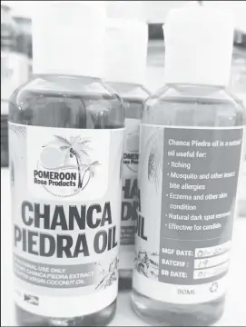  ?? ?? Chanca Piedra oil used for insect bites and allergies, made by Pomeroon Rose