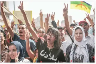  ??  ?? Demonstrat­ors chant slogans during a protest in Casablanca, Morocco on Sunday. (AP)