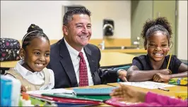  ?? LANNIS WATERS / THE PALM BEACH POST ?? Palm Beach County Schools Superinten­dent Robert Avossa chatted with Grassy Waters Elementary School second-graders Arianna Payne (left) and Ma’Kayla Robinson on Aug. 14, the first day of school.