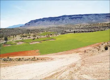  ?? TONYA HARVEY/REAL ESTATE MILLIONS ?? Constructi­on continues on The Summit’s 18-hole, Tom Fazio course, which is expected to open next spring.