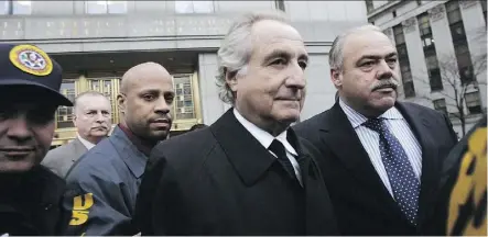  ?? HIROKO MASUIKE/GETTY IMAGES ?? Bernard Madoff, centre, is serving a 150-year prison term for defrauding investors in a US$19-billion Ponzi scheme. Madoff’s victims received US$12 billion so far for lost principal.