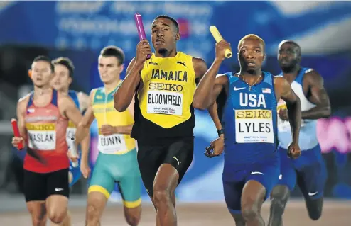  ?? Picture: Getty Images ?? Akeem Bloomfield of Jamaica and Noah Lyles of the US during day one of the men's 4x400m IAAF World Relays in Yokohama yesterday.