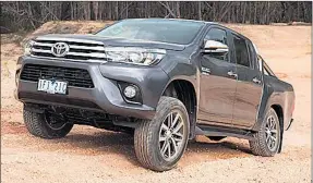  ??  ?? HI TOP: The Toyota Hilux was the best-selling model in Australia for the second consecutiv­e year, but Ford’s Ranger is not far behind.