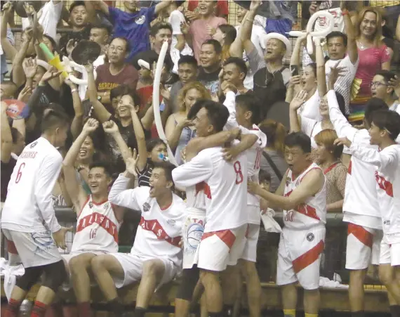  ?? SUNSTAR FOTO / ALEX BADAYOS ?? HAPPY FEET. Members of the Talisay City Aquastars and their supporters celebrate after winning Game 3 of the Governor’s Cup.