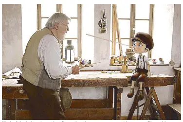  ??  ?? Mario Adorf plays toymaker Geppetto who carves a puppet he names Pinocchio