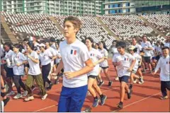  ?? AMBASSADE DE FRANCE AU CAMBODGE ?? Runners take part in the ‘Relay around the World’ event at the National olympic Stadium on February 16.