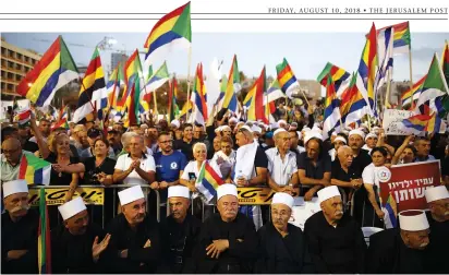  ?? (Corinna Kern/Reuters) ?? DRUZE COMMUNITY leaders and supporters protest the Jewish Nation-State Law on Saturday night in Rabin Square in Tel Aviv.