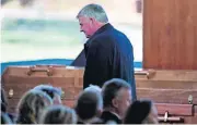  ?? [AP PHOTO] ?? Pastor Franklin Graham walks near the casket of his father Friday during a funeral service for the Rev. Billy Graham, who died last week at age 99, at the Billy Graham Library in Charlotte, N.C.