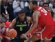  ?? AL GOLDIS — THE ASSOCIATED PRESS ?? Michigan State’s Cassius Winston, left, drives against Ohio State’s Kaleb Wesson during the first half Feb. 17.