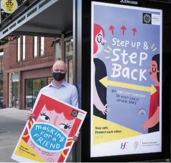  ??  ?? KEEP SAFE: Minister for Health Stephen Donnelly launching a new Covid-19 poster campaign. The Fatti Burke-designed campaign promotes safe behaviours to reduce the risk from the virus