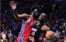  ?? MATT SLOCUM — THE ASSOCIATED PRESS ?? The Sixeers are headed back to Miami tied with the Heat thanks, in large part, to the return of center Joel Embiid, left, defending Miami’s Bam Adebayo in Game 4 Sunday.
