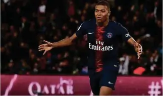  ??  ?? Paris Saint-Germain’s French forward Kylian Mbappe celebrates after scoring a goal during the French L1 football match between PSG and Olympique de Lyon recently. The club has announced that they were launching their own cryptocurr­ency in partnershi­p with Socios.com.