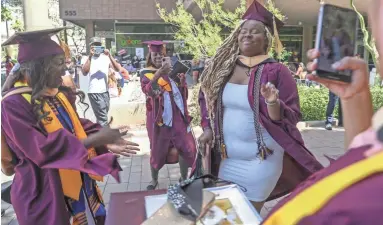  ?? NICK OZA/THE REPUBLIC ?? ASU grads from the schools of Community Resources and Developmen­t, Criminolog­y and Criminal Justice, Public Affairs, Social Work, and the Interdisci­plinary Programs in Watts College celebrate Monday in Phoenix.