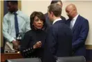  ??  ?? Maxine Waters talks with Mark Zuckerberg after he testified. Photograph: Chip Somodevill­a/Getty Images