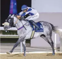  ?? PICTURE: Juhaim ?? Anas al-Seyabi rides Tajamhor to Al Dibal Cup victory at the Al Rayyan Racecourse on Wednesday.