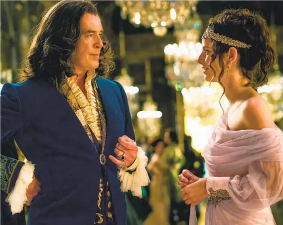  ?? GRAVITAS VENTURES ?? Pierce Brosnan as King Louis XIV and Kaya Scodelario as Marie-Josephe D’Alember in “The King’s Daughter.”