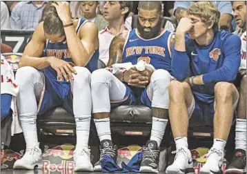  ??  ?? Knicks players look rightly distraught during indefensib­le performanc­e against Nets Sunday night.