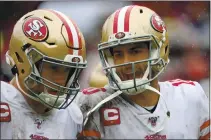  ?? PATRICK SMITH — GETTY IMAGES, 2019 ?? Jimmy Garoppolo talks with George Kittle during the first half in a game against the Washington Redskins at FedExField in Landover, Maryland.