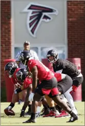  ?? JOHN BAZEMORE — THE ASSOCIATED PRESS FILE ?? In this July 25, 2019, file photo, Atlanta Falcons quarterbac­k Matt Ryan (2) and the offense prepare to run a play during their NFL training camp football practice in Flowery Branch, Ga. Several NFL teams are reopening their training facilities Tuesday, while many are prohibited by government restrictio­ns during the coronaviru­s pandemic. Among the teams taking advantage of using their buildings on the first day they are allowed are the Falcons, Cardinals and Colts.
