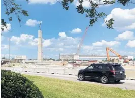  ?? RED HUBER/STAFF PHOTOGRAPH­ER ?? Interstate 4’s 90-foot concrete pylons are decorative but also will serve as points where motorists can directly access the interstate’s new toll lanes.