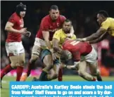  ??  ?? CARDIFF: Australia’s Kurtley Beale steals the ball from Wales’ Steff Evans to go on and score a try during a rugby union internatio­nal match at the Principali­ty Stadium, Cardiff. — AP