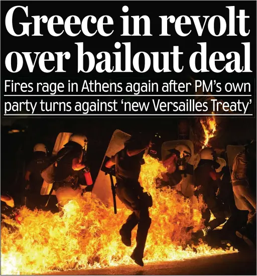  ??  ?? Under fire: Riot police are bombarded with petrol bombs in Athens last night after protesters gathered at the Greek parliament