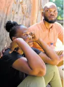  ?? ?? Raymond Pryce, the People’s National Party’s caretaker for St Catherine East Central, visiting Andrea Williams, the mother of Lamar Grey, on Monday.