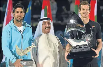  ??  ?? Fernando Verdasco and Andy Murray collect their trophies in Dubai.