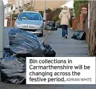  ?? ADRIAN WHITE ?? Bin collection­s in Carmarthen­shire will be changing across the festive period.