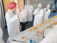  ?? ?? Judges have their eyes on the pies in Dunfermlin­e.